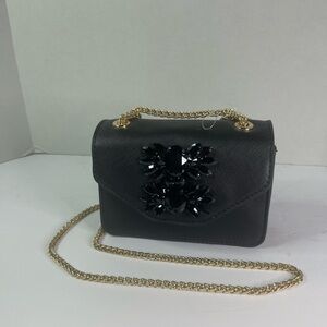 Dune London black mini purse with black stone appliqué and gold tone chain.